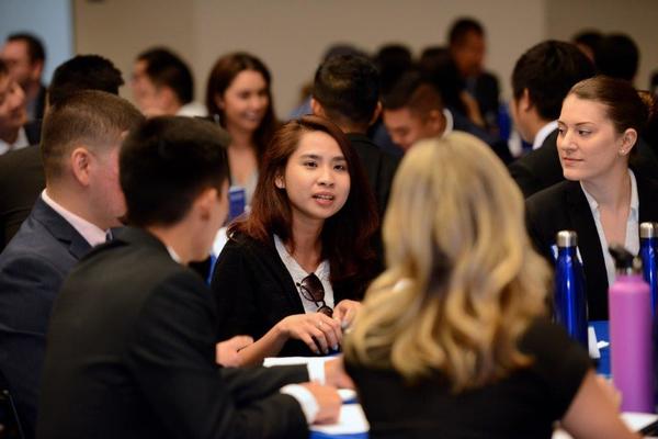 Business Students Sitting Around a Table at a College Event