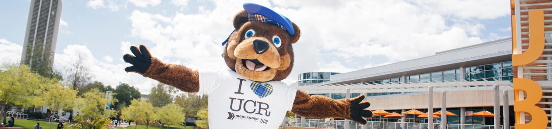 Scotty the Bear in front of the Hub and Bell Tower