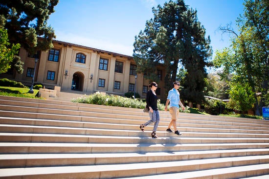 Students walking down the steps of Anderson Hall School of Business